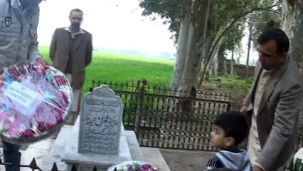 laying wreath on the grave of our shaheed