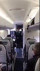 Flight attendant keeping passengers entertained...