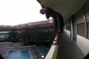 OMG !! Guy Jumps into Swimming Pool from a Hotel Balcony - Luckily Survived