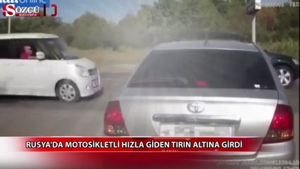 Rusya'da hızla giden tırın altına girdi