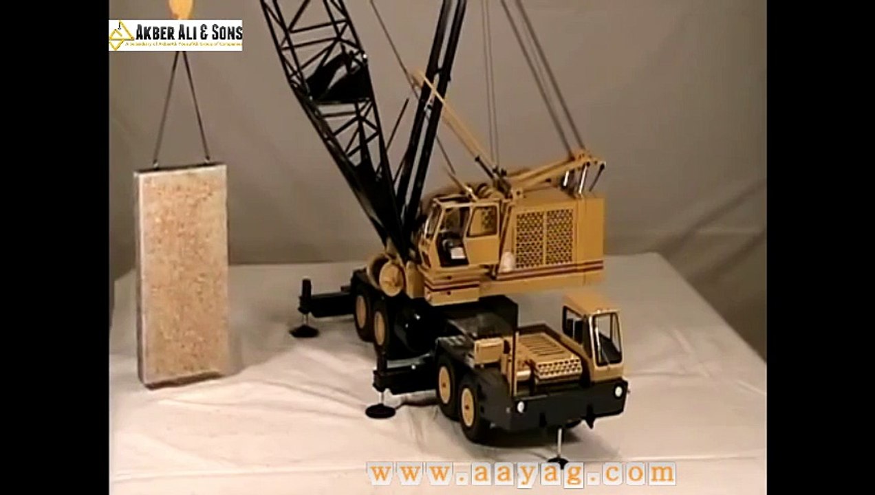 A 1-16 scale 150 ton Grove model crane lifting an 80 ton granite