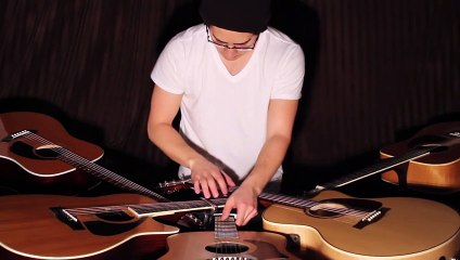 Ce type est une bête ! Il joue un morceau avec 5 guitares à la fois ! Admirez !