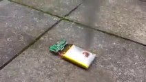 Explosion of a phone battery after stabbing it with a knife