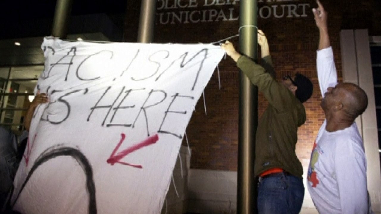 Two police officers shot outside Ferguson police station