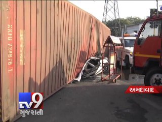 Container truck rolls over and flattens car, one injured - Tv9 Gujarati