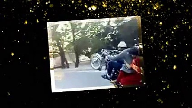 Pakistani Boy Performing One Wheeling with A Girl Sitting on Bike