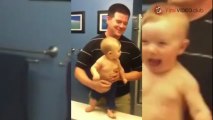 BABY ADORABLY FLEXES MUSCLES WITH DAD.mp4