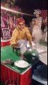 A Talended Indian Boy Mixing Suger In Milk In His Amazing Style