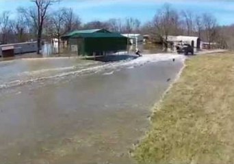 Indiana Residents Wakeboard on Ohio River Flood Water