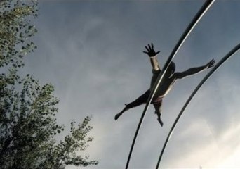 Acrobat Does Outdoor Performance on a Trampoline