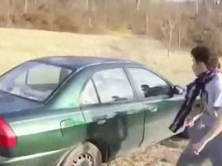 Crazy guy trying to break car window with his head - funny!