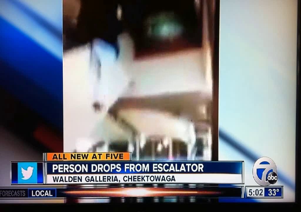 man falls from escalator