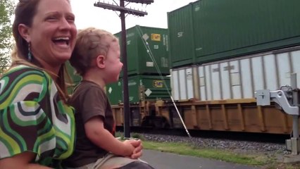 A child sees his father drive a train