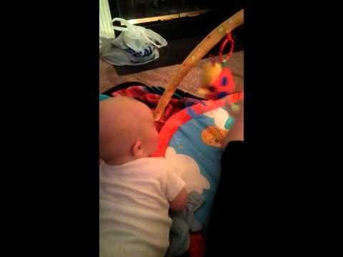 Cute Baby Laughs at Mum's Feet