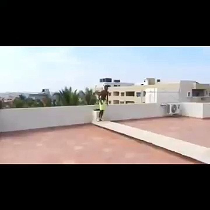 Crazy guy jumps of hotel roof!