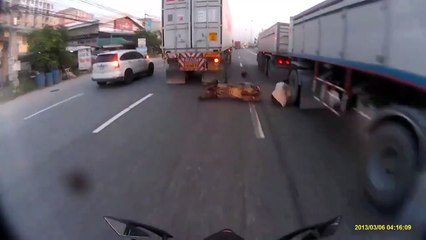 The Man Who Is Very Luck Just Missing Death that Between Two Trucks in A Bike