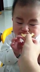 Baby eating Orange for the First time