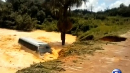 Bus falls through massive crater in Brazil and floats away