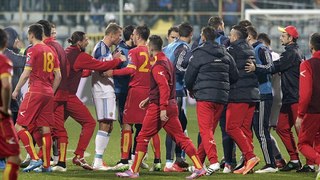 Montenegro vs Russia suspended after Igor Akinfeev is struck by flare then ABANDONED because of mass brawl