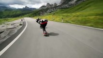 Crazy downhill skateboarders overtaking cyclists in the Alps roads!