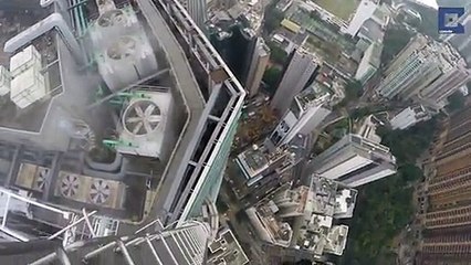 Des ados escaladent un gratte-ciel de 250m de haut sans protection