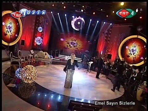 Emel Sayın ~ Bir kızıl goncaya benzer dudağın