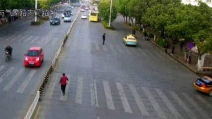 Woman rescued from underneath a car in China
