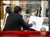 Abid Ali showing off his amazing paintings & also sketching off his wife
