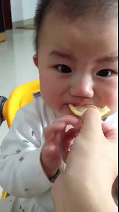 child eating lemon with extremely socks