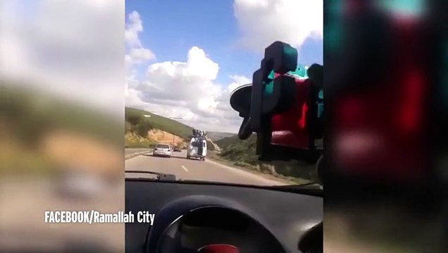 van carrying passengers on its roof swerves out of control