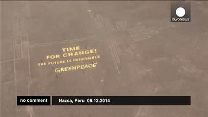 Giant Greenpeace protest banner set up beside ancient Nazca Lines - no comment