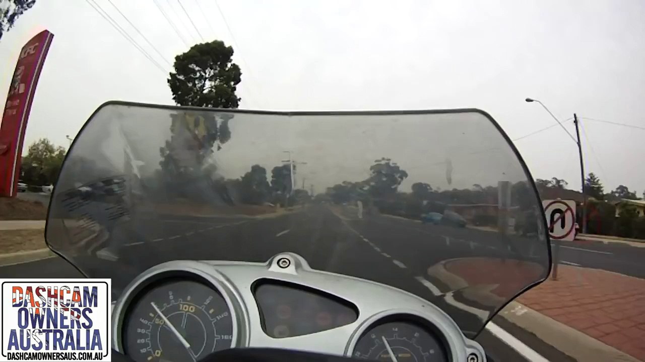 Car pulls across Motorcycle rider causing crash.