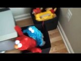 2 plush toys Elmo and Cookie Monster having a great time together