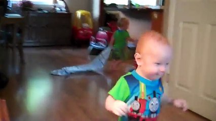 Twin boys playing with their Boston Terrier