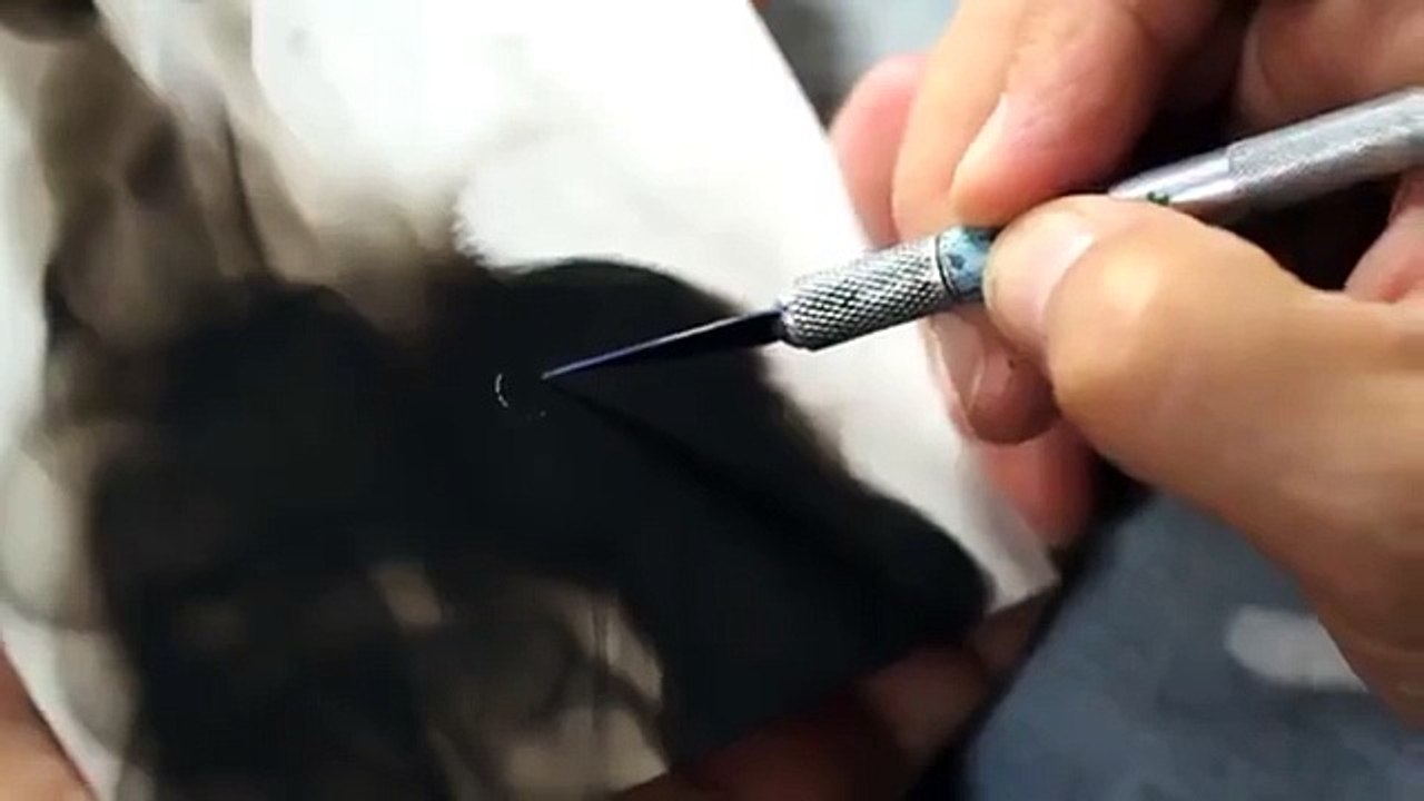 Man Paints a Painting With Help of Fire