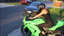 Girl Wheelie on Motorcycle Yamaha R1