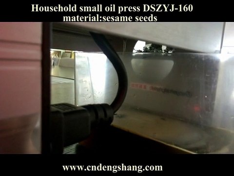 pressing oil from sesame seeds with our oil press machine for home using