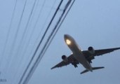 Japan Airlines Plane Flies Low Over Power Lines in Toyonaka City