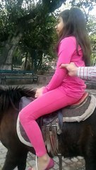 hafsa on pony in zoo