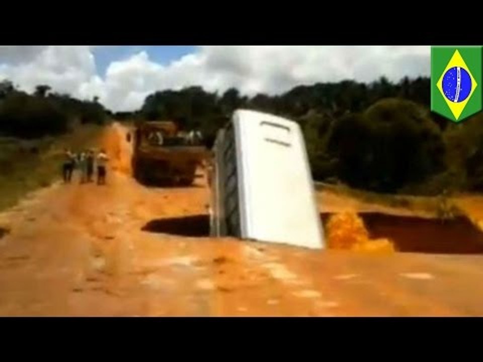 Caught on tape: Bus plunges through massive sin...