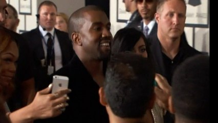 Kanye West settles paparazzo lawsuit