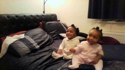 Twin babies dancing