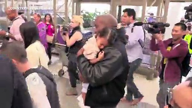 Kim Kardashian_ Kanye West_ North West MOBBED At LAX 2015
