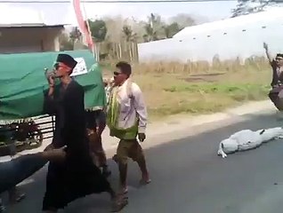 A body falls from his coffin during a ceremony