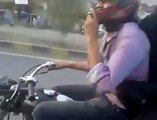 Wow!!! Boy wheeling on Bike with Girl Friend