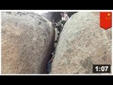 Une femme se retrouve coincée entre deux pierres géantes à cause de ses fesses et sa poitrine
