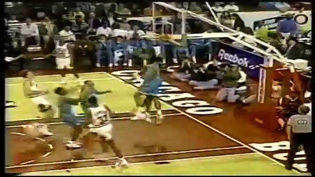 Michael Jordan dunks twice over Alonzo Mourning