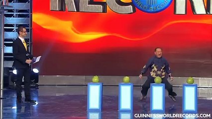 Fastest time to pierce 4 coconuts with 1 FINGER! - Guinness World Records Classics