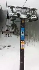 A tree falls on a ski lift