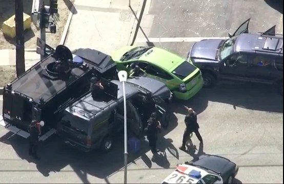 LAPD uses multiple armored SUVs to pin down and trap a stolen prius taxi